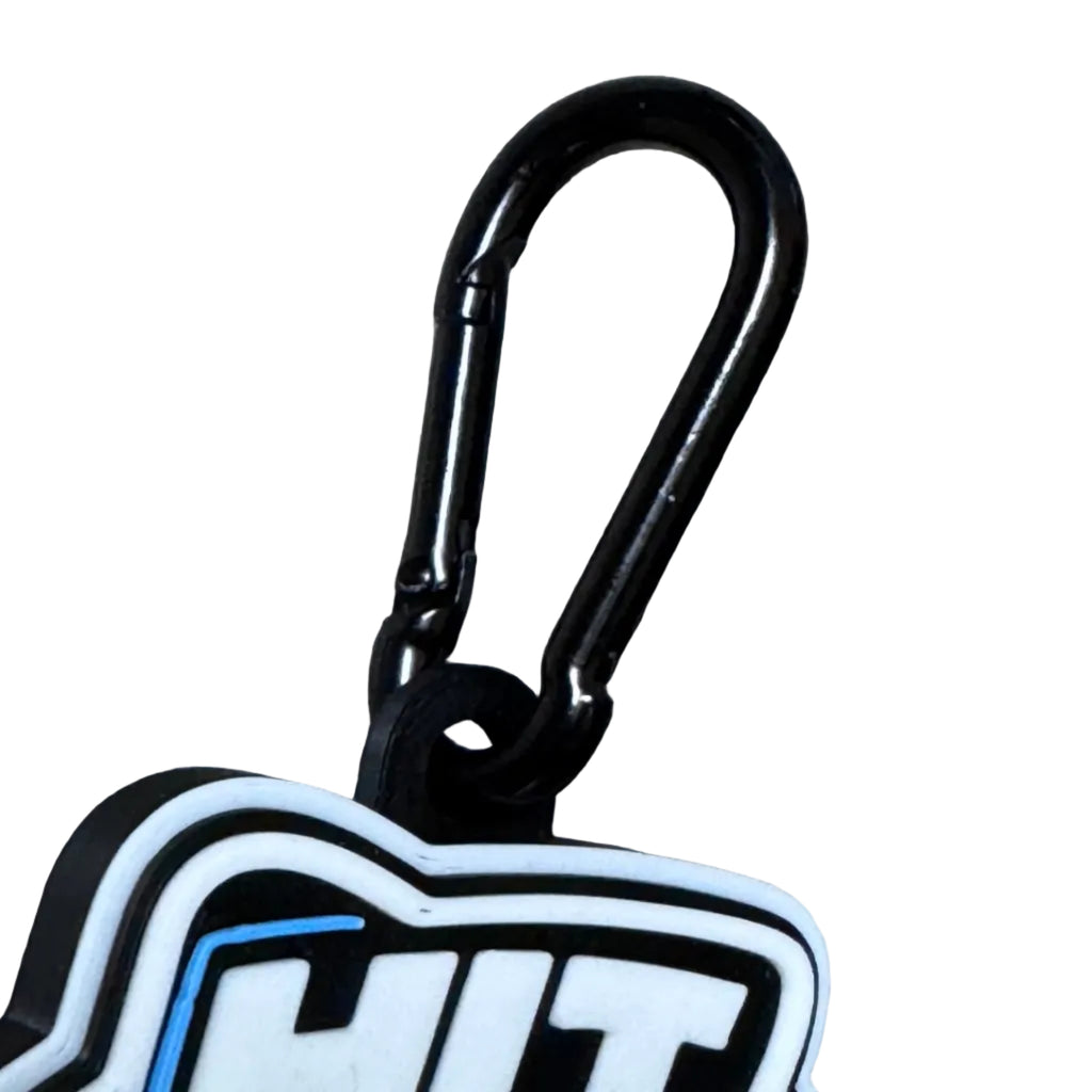 Keychain with a blue and white design on a wooden surface