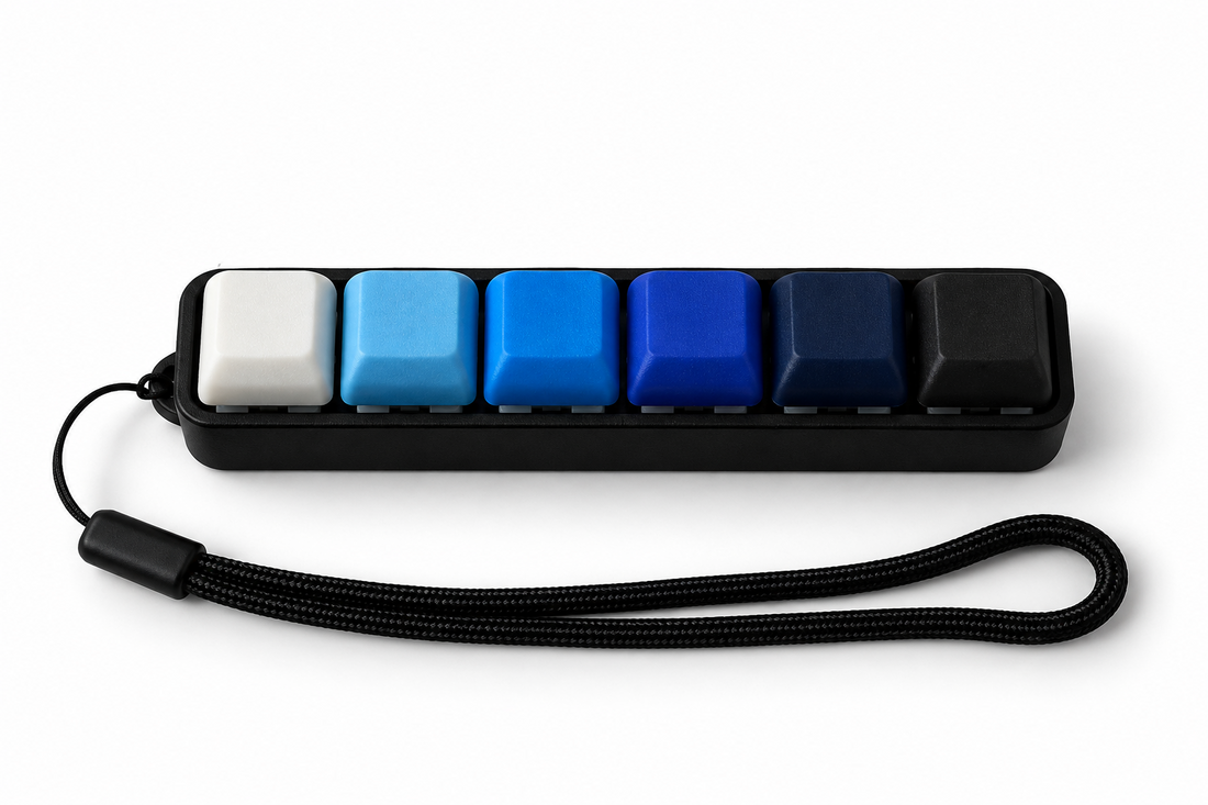 ClickerBar Max six-key 3D-printed mechanical fidget with blue gradient keycaps and wrist strap