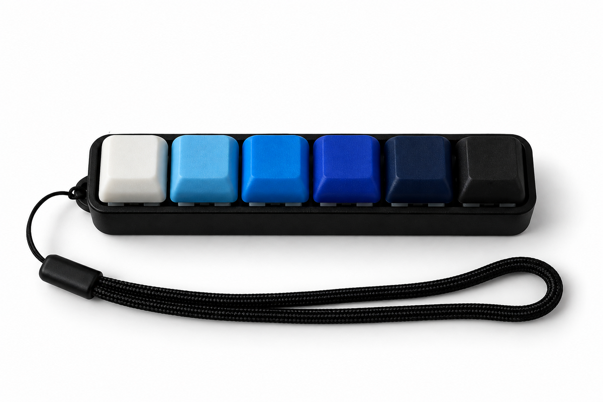 ClickerBar Max six-key 3D-printed mechanical fidget with blue gradient keycaps and wrist strap