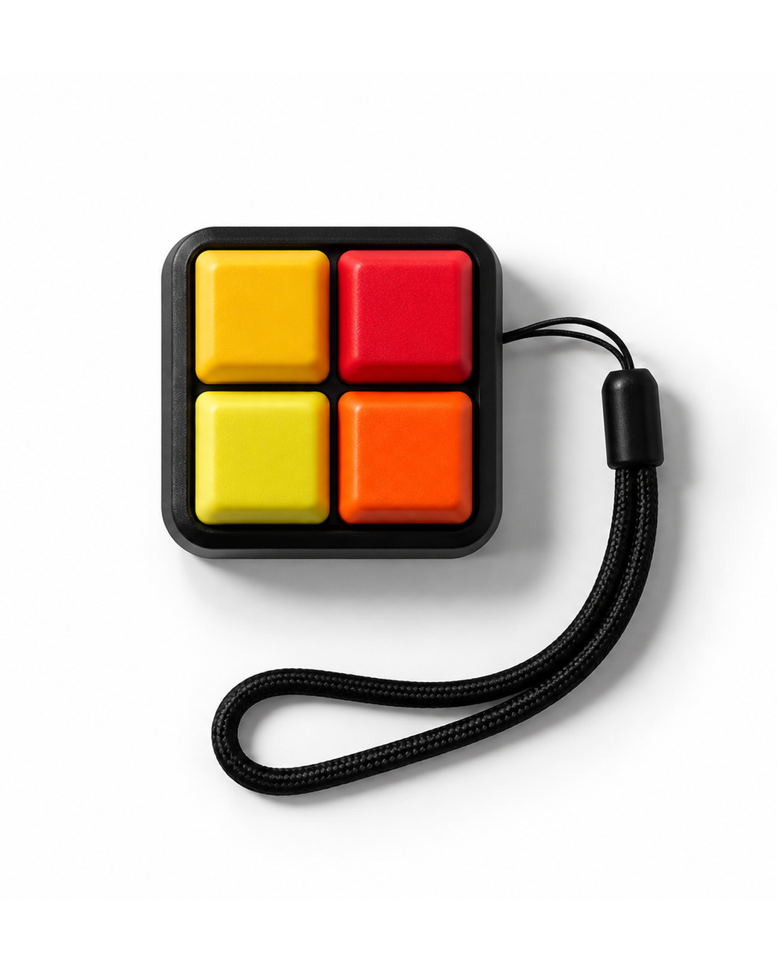 ClickerPad Mini 2×2 mechanical fidget with four colorful keys, black housing, wrist strap and white background
