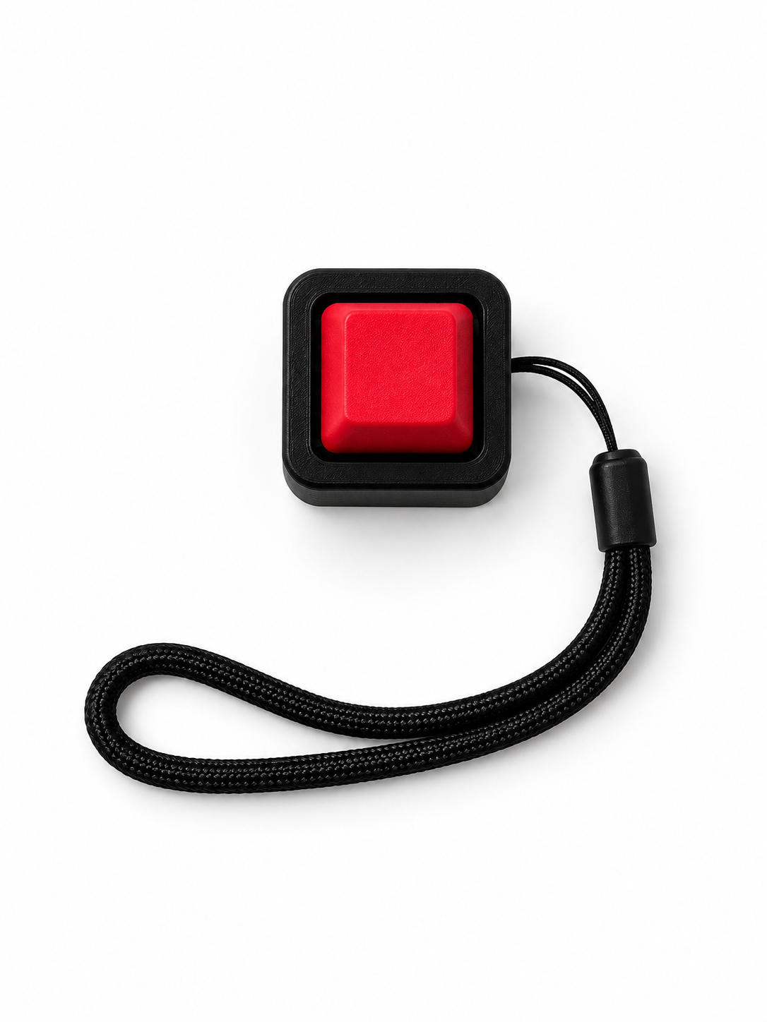 ClickerSolo with one red keycap in a black base and black wrist lanyard on white background
