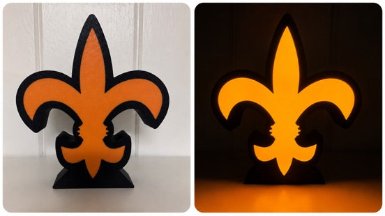 Churchville-Chili Saints Fleur-de-Lis Lightbox illuminated and unlit side-by-side product image